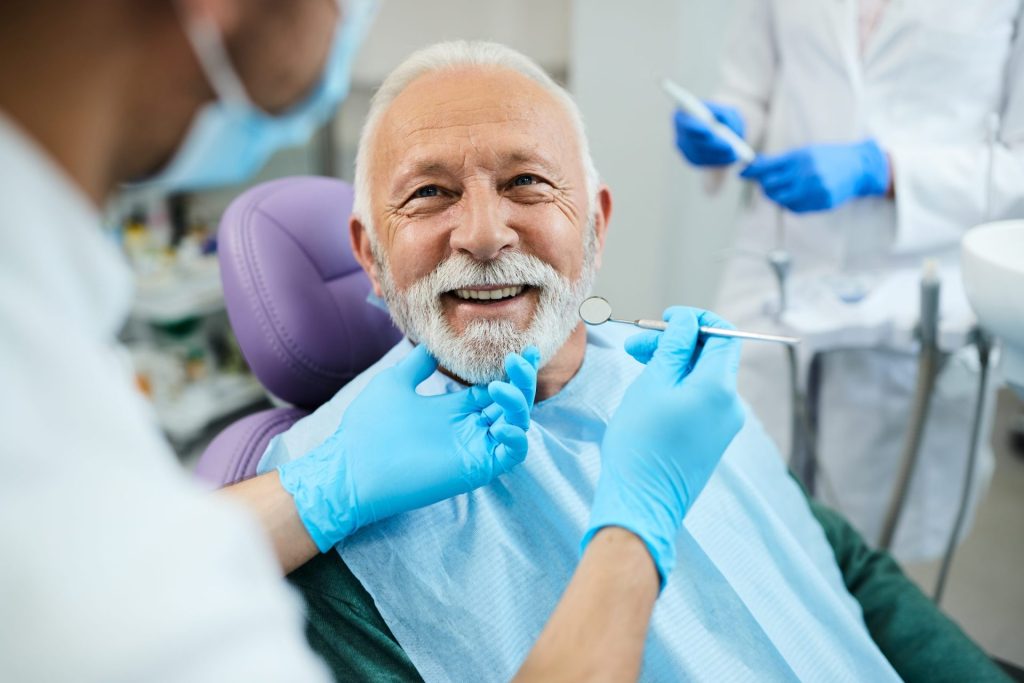 Smiling senior man during a dental checkup